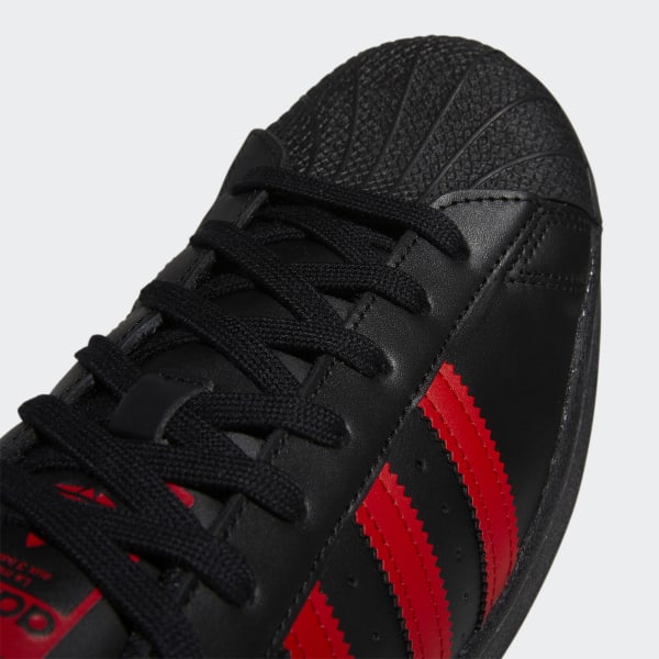 Adidas superstar black with red stripes online