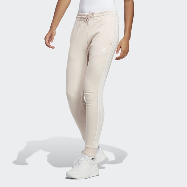 https://assets.adidas.com/images/w_600,f_auto,q_auto/6e1b9c84d206442ebeaeaf1e00cdf2c1_9366/Essentials_3-Stripes_French_Terry_Cuffed_Pants_Pink_IC9924_21_model.jpg