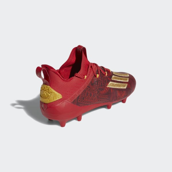 red and gold adidas football cleats
