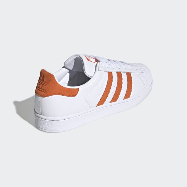 orange and white shell toe adidas
