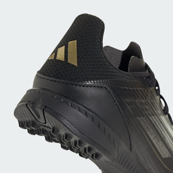Black adidas turf shoes discount