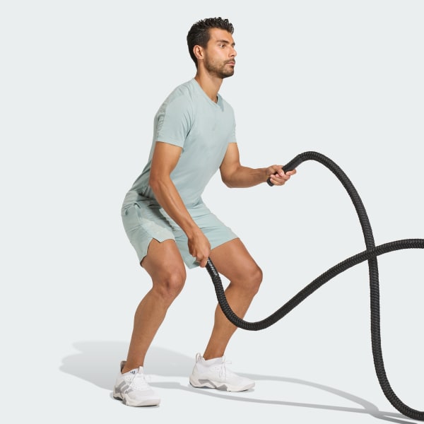 Verde Shorts de 3 rayas diseñados para entrenar