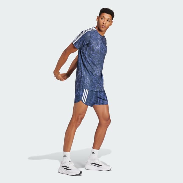 Niebieski Szorty Own the Run Excite Allover Print AEROREADY