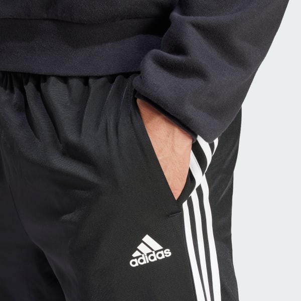 adidas Essentials Warm-Up Tapered 3-Stripes Track Pants - Black | Men's ...
