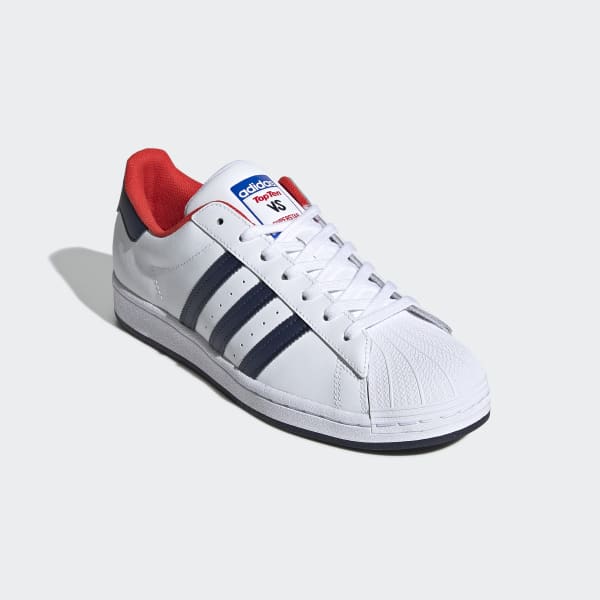 white adidas with red