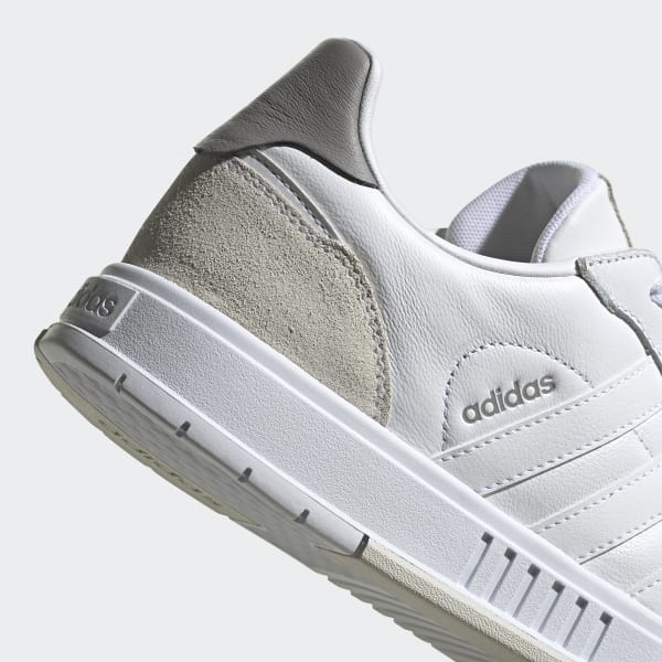 grey and white adidas sneakers