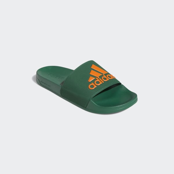 green and white adidas slides