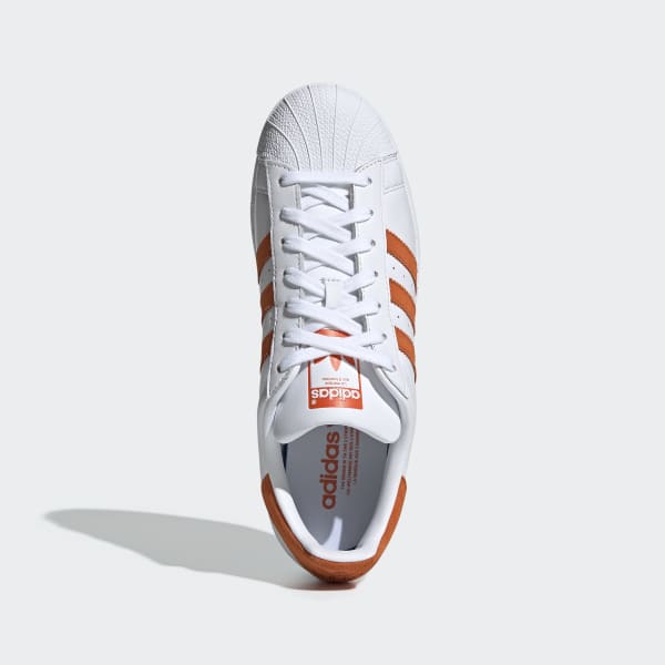 adidas with orange stripes