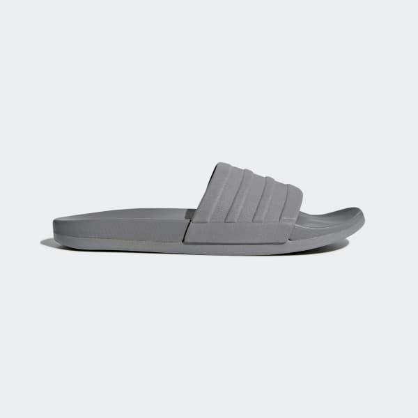 grey and white adidas slides
