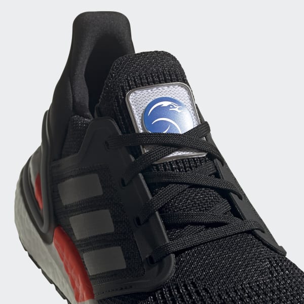 white shoes with three black stripes