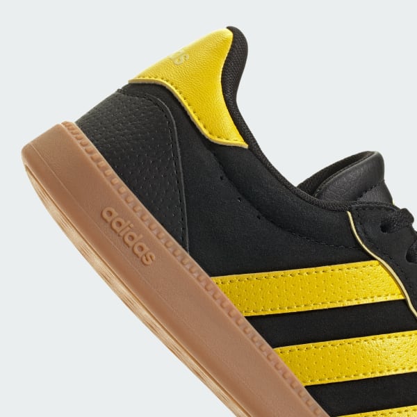 Adidas black and yellow shoes top