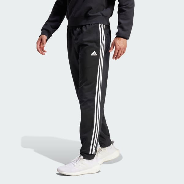cerná Sportovní kalhoty Primegreen Essentials Warm-Up Tapered 3-Stripes E1944