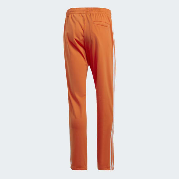 Men's Firebird Track Pants in Orange | adidas US