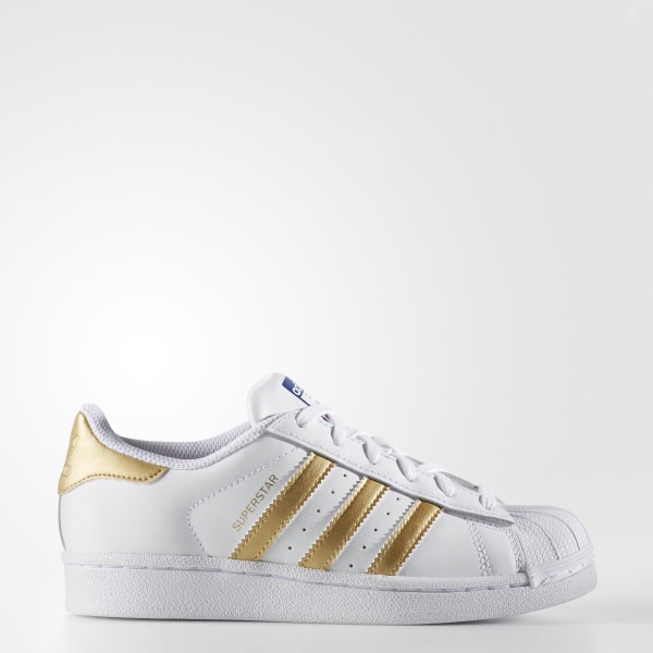 white shoes with golden stripes