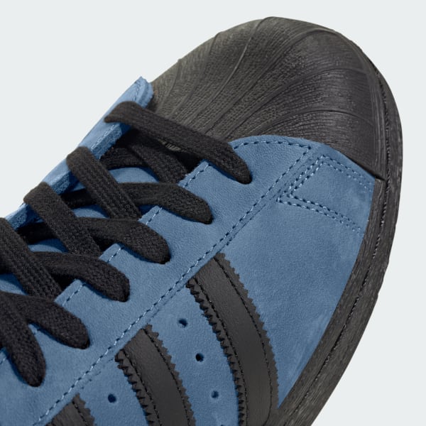 Navy blue adidas superstar top shoes