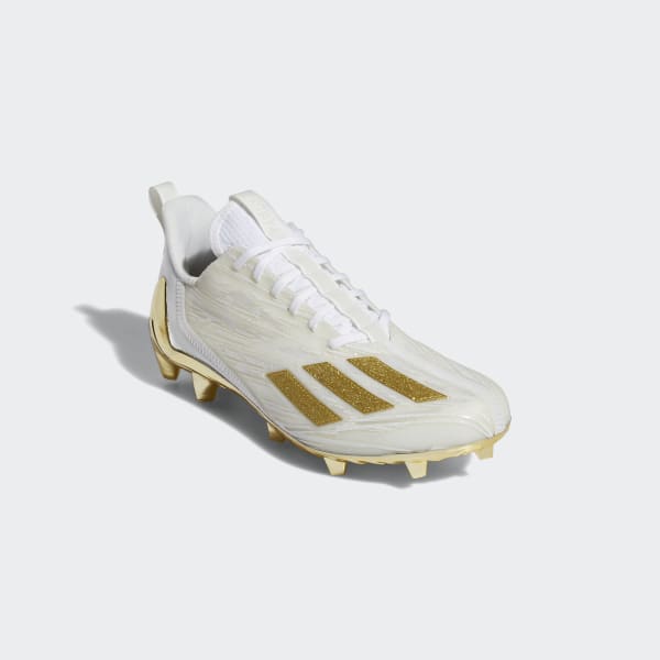 white and gold adizero cleats