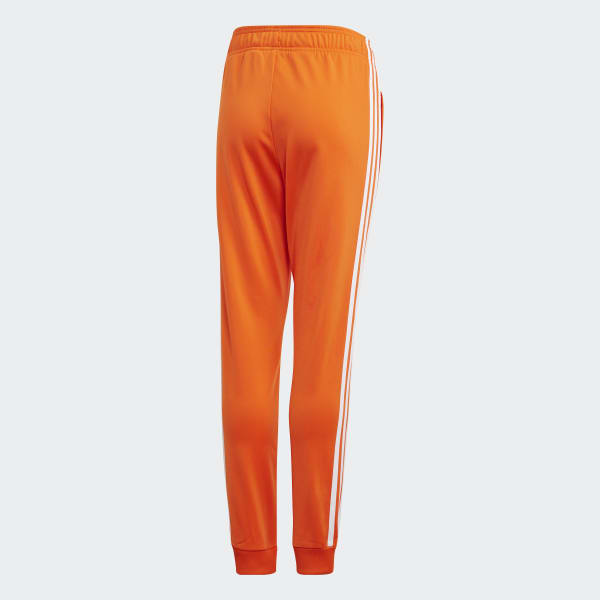 orange and white adidas pants