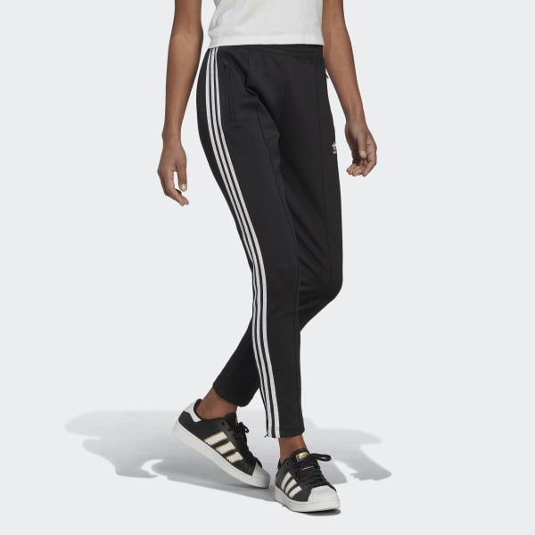 black and blue adidas track pants