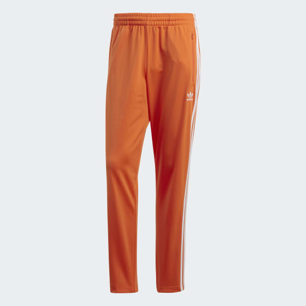 Firebird Track Pants in Orange | adidas 
