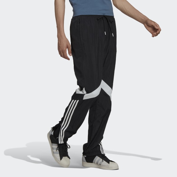 Jogging adidas noir regular fit en partie en matières recyclées à bandes  emblématiques latérales blanches | Rue Des Hommes