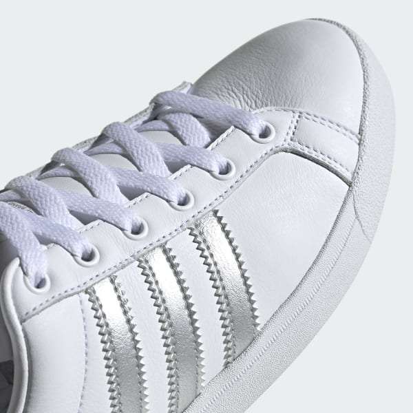 white and silver adidas shoes