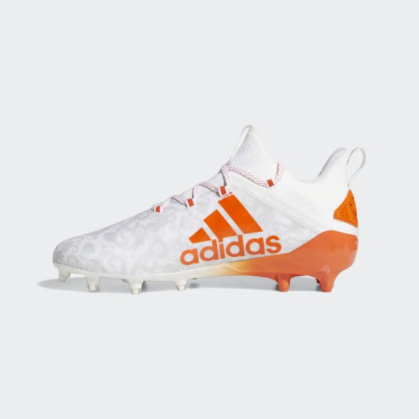 orange and white adidas football cleats