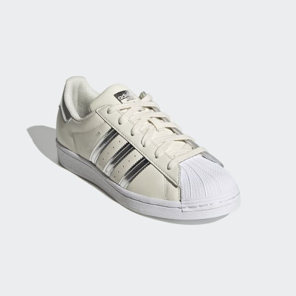 white and silver adidas shoes