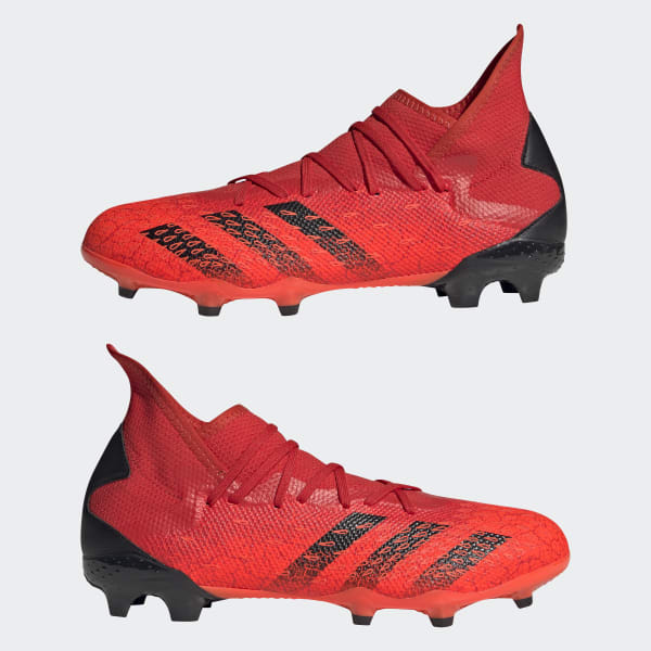 Red adidas predator football boots top