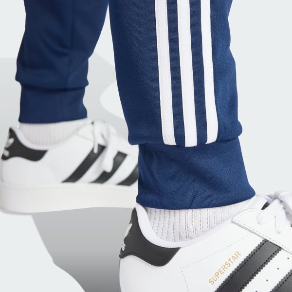 Adidas sst track pants blue sales
