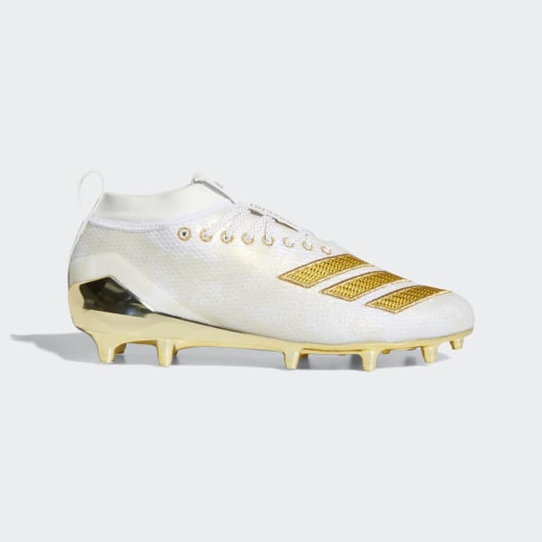 white and gold cleats