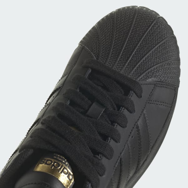 Adidas superstar noir 2025 gold