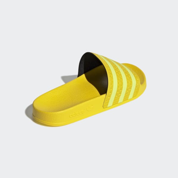 yellow adidas sliders