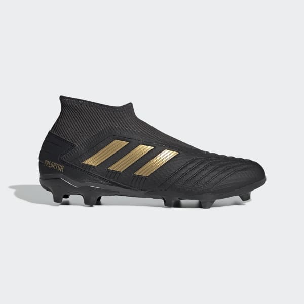 black and gold laceless football boots