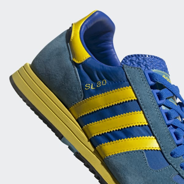 blue and yellow adidas trainers