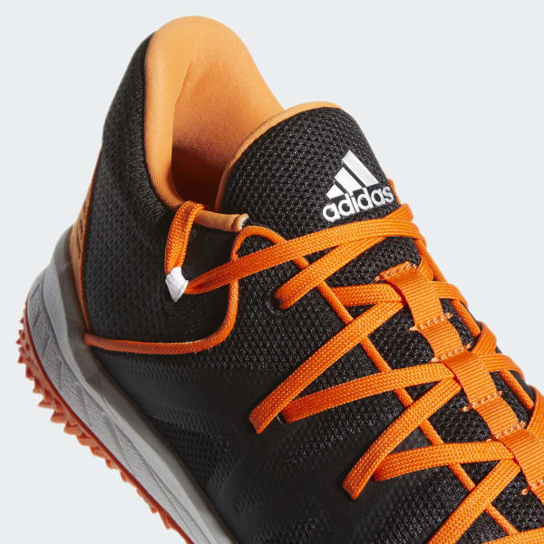 black and orange turf shoes