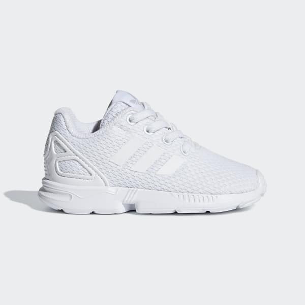 white adidas flux trainers