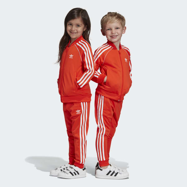 black adidas tracksuit with red stripes
