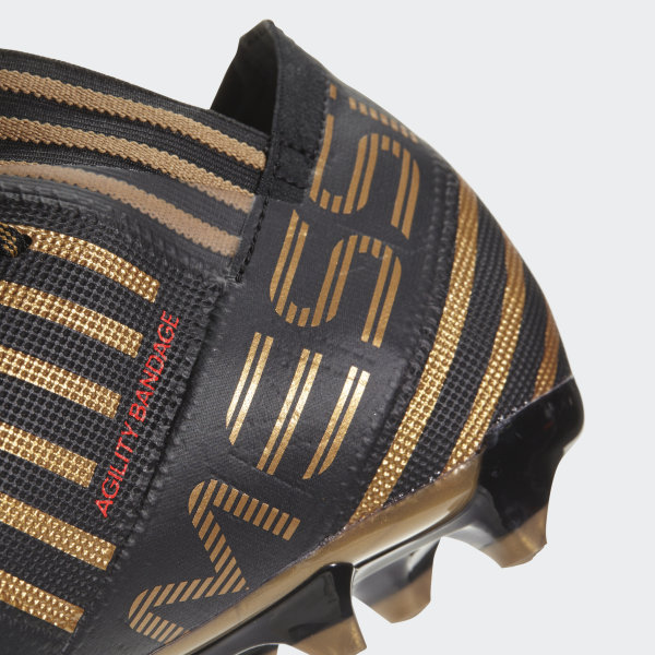 black and gold messi boots