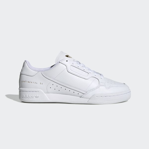 white and gold adidas trainers