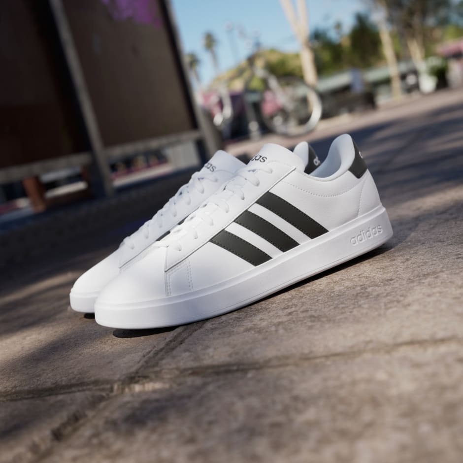 Adidas white shoes with black stripes on one side online