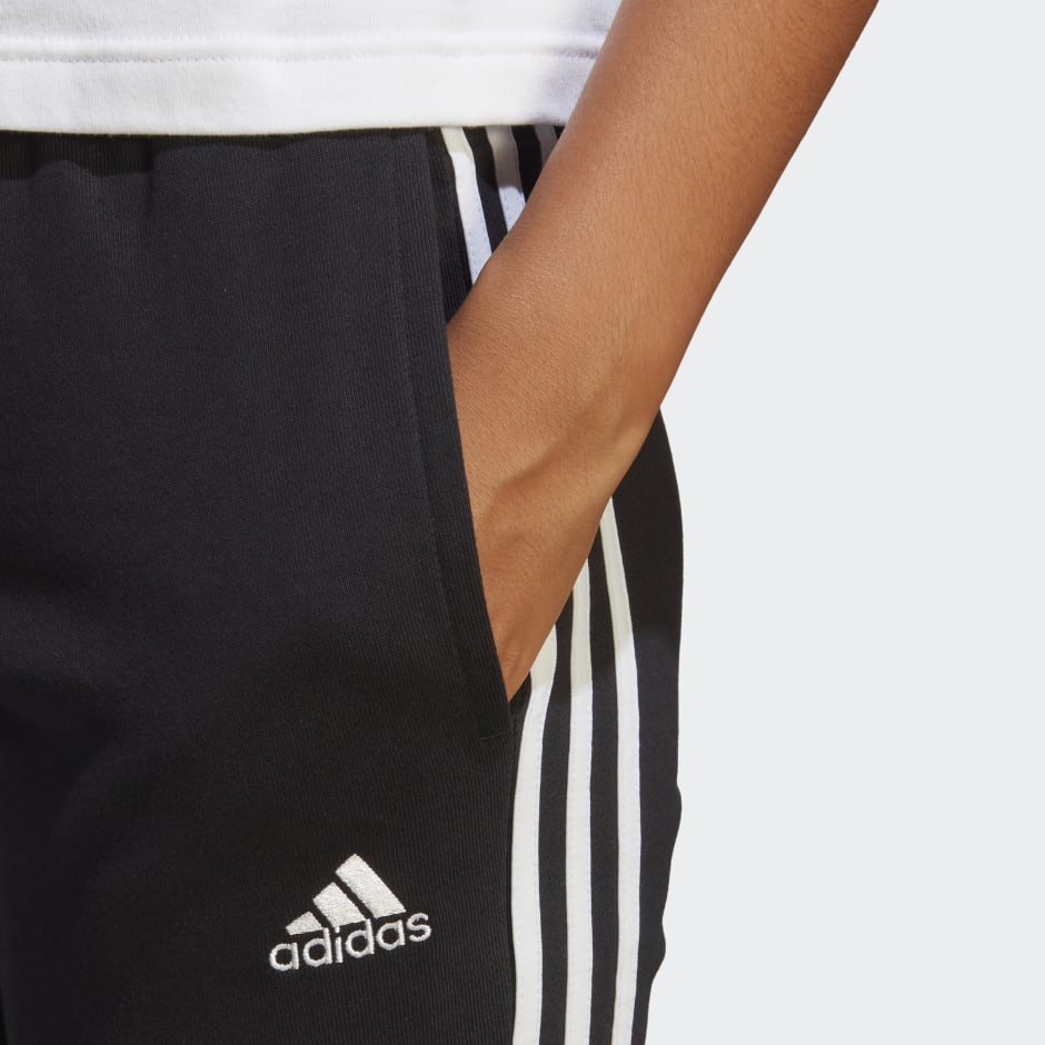 adidas Essentials 3-Stripes French Terry Cuffed Pants - Black | adidas UAE