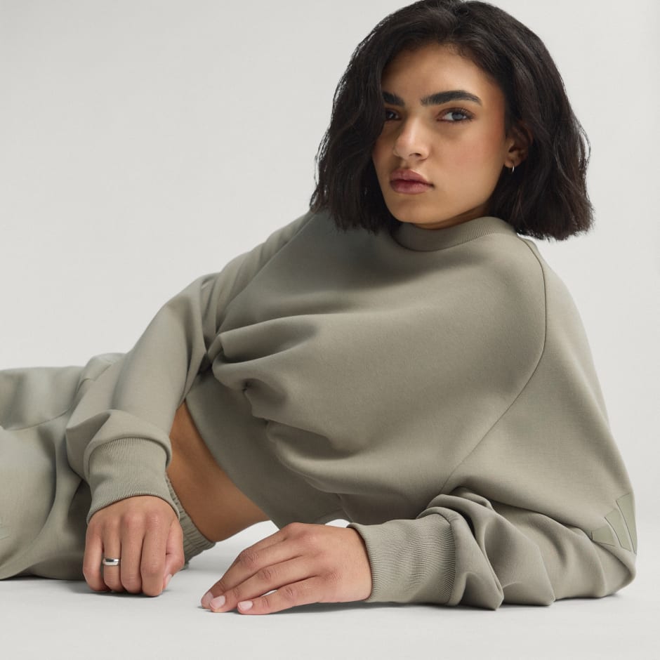 CLOTHING - Soft Lux Loose Sweatshirt - Green | adidas Oman
