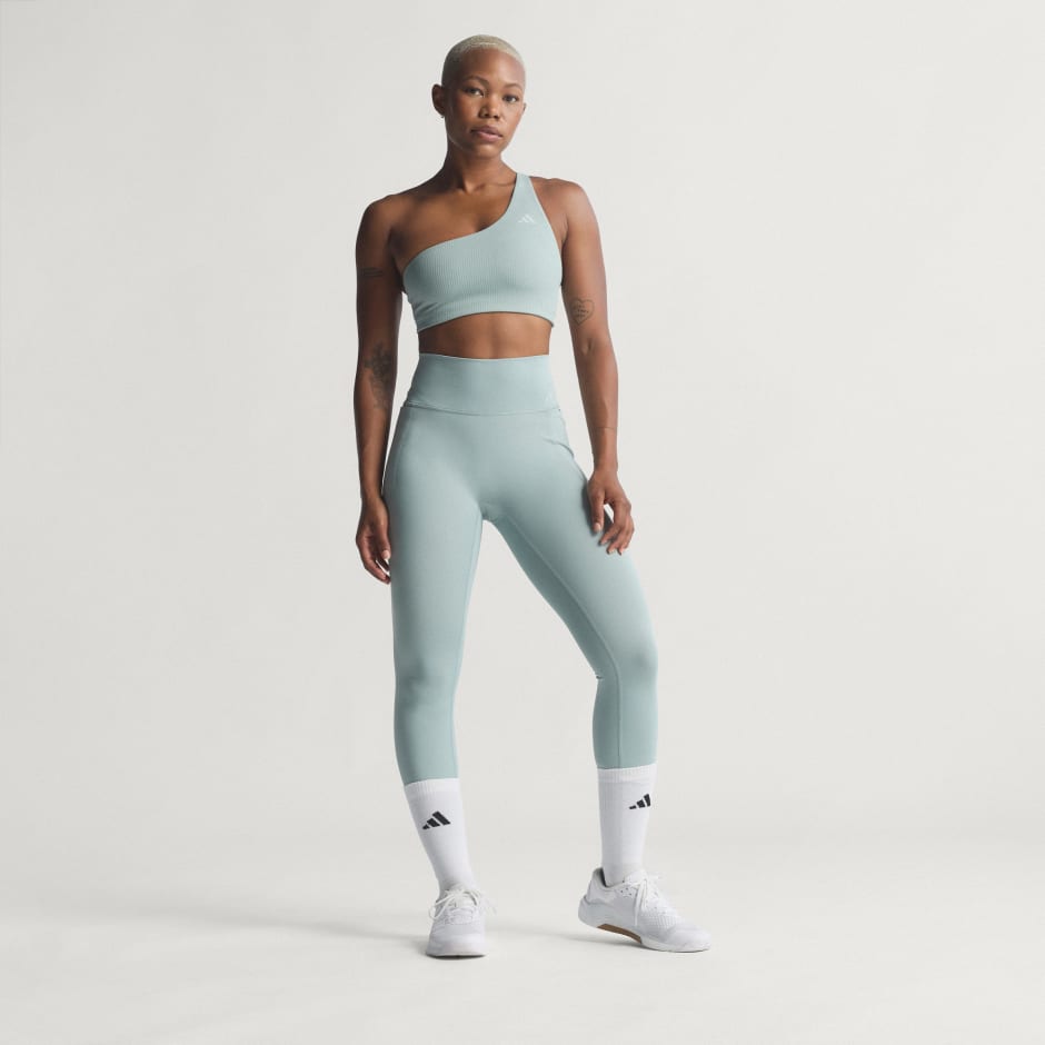 Sutien de antrenament Optime su striații, un umăr gol și susținere ușoară