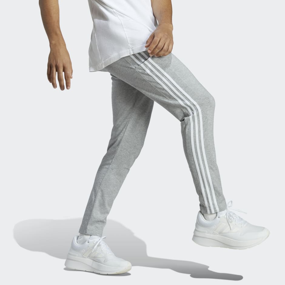 adidas Essentials Single Jersey Tapered Open Hem 3-Stripes Pants - Grey |  adidas SA