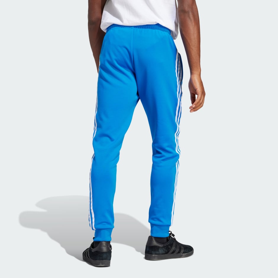 Clothing - Adicolor Classics SST Track Pants - Blue | adidas South Africa