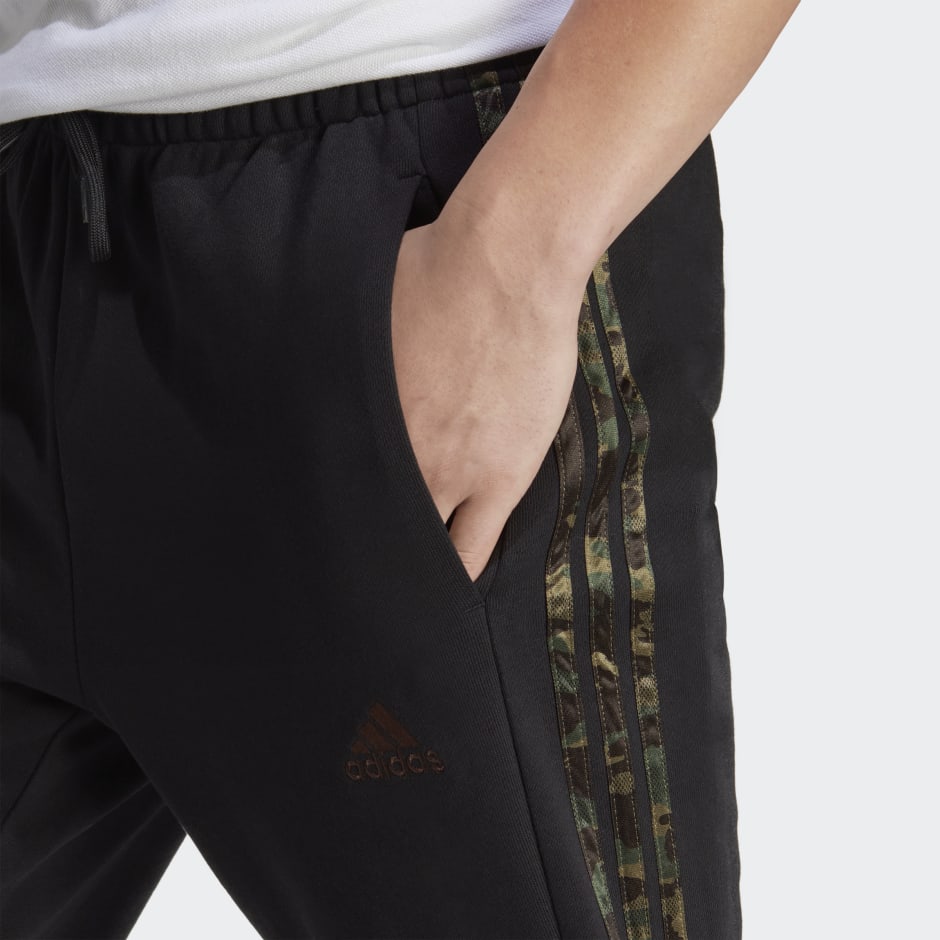 Clothing - Essentials French Terry Tapered Elastic Cuff 3-Stripes Pants - Black | adidas Oman