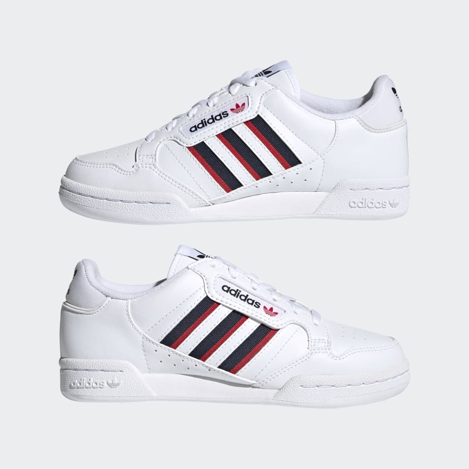 white adidas shoes with red stripes