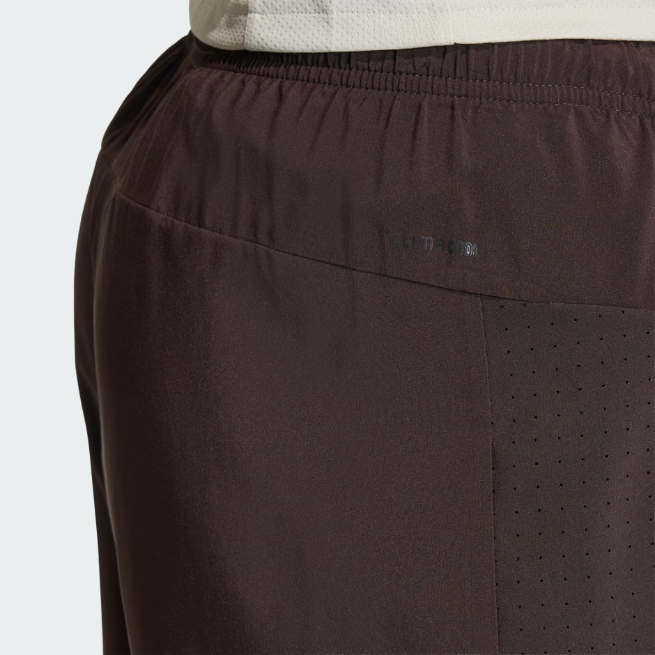 WORKOUT ESSENTIALS BASE WOVEN SHORT